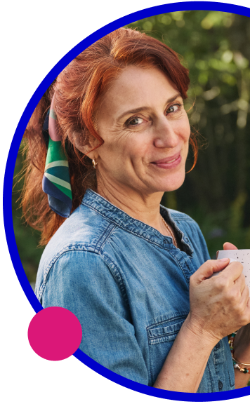 Woman outside holding a mug